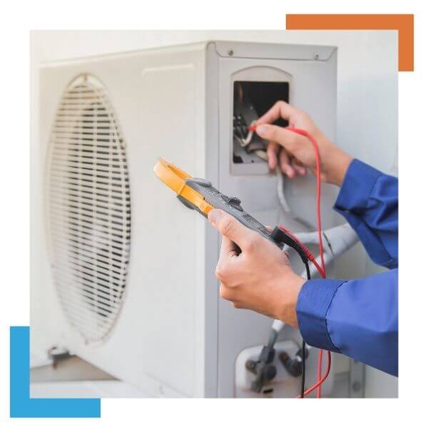 HVAC tech working on a heat pump