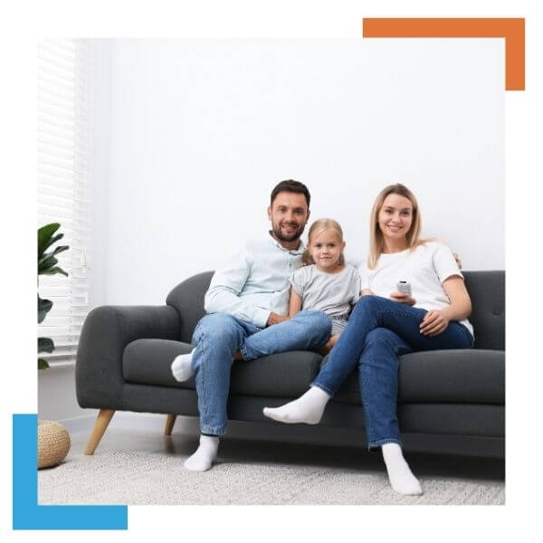 Family sitting comfortable on their couch